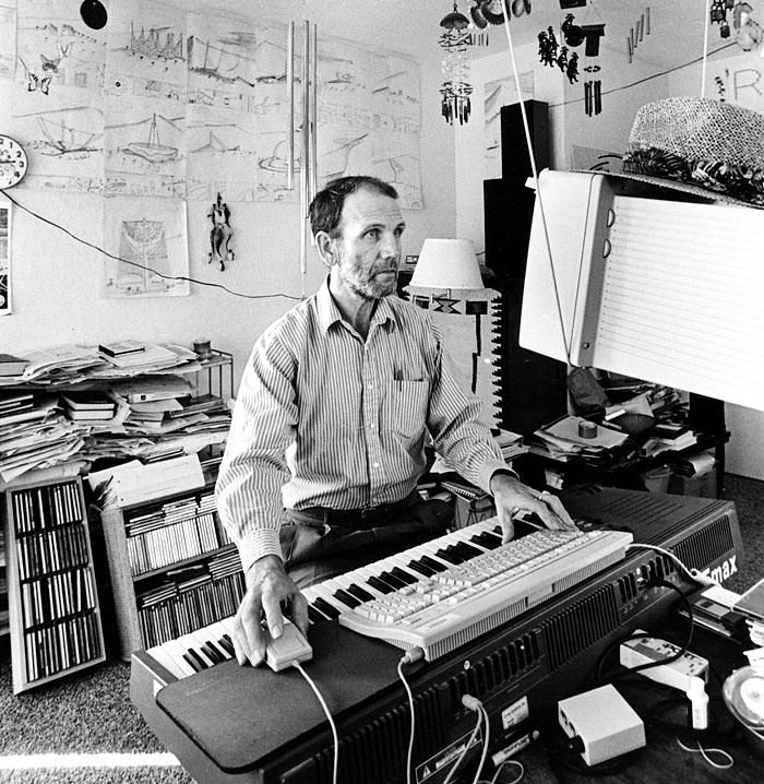 composer david cope in front on his electric piano and computer